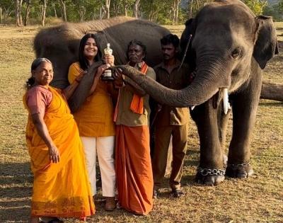 Bomman, Bellie, Bommi & Raghu of 'The Elephant Whisperers' pose with the Oscar | Bomman, Bellie, Bommi & Raghu of 'The Elephant Whisperers' pose with the Oscar