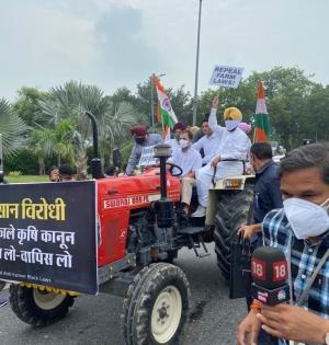 Rahul drives tractor to Parliament, demands withdrawal of 3 farm laws | Rahul drives tractor to Parliament, demands withdrawal of 3 farm laws