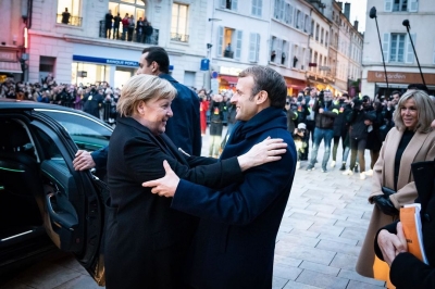 Macron offers Merkel French national honour on her farewell trip | Macron offers Merkel French national honour on her farewell trip