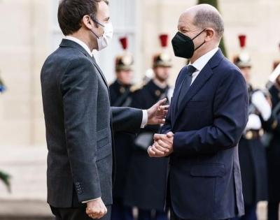 Macron, Scholz meet in Paris, vow to enhance ties | Macron, Scholz meet in Paris, vow to enhance ties