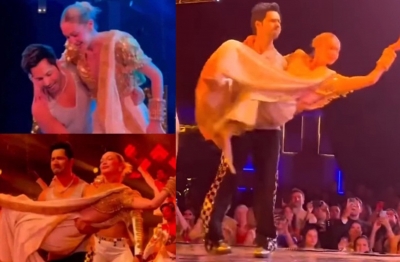 Varun Dhawan picks Gigi Hadid up, spins around on stage, pecks her | Varun Dhawan picks Gigi Hadid up, spins around on stage, pecks her Varun Dhawan picks Gigi Hadid up, spins around on stage, pecks her | Varun Dhawan picks Gigi Hadid up, spins around on stage, pecks her