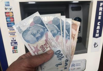 Turkish lira tumbles after sacking of central bank head | Turkish lira tumbles after sacking of central bank head