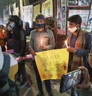 A year after Jamia violence, protesters take out candle march, detained | A year after Jamia violence, protesters take out candle march, detained A year after Jamia violence, protesters take out candle march, detained | A year after Jamia violence, protesters take out candle march, detained