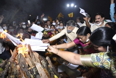 Naidu burns Andhra govt orders in Bhogi bonfire | Naidu burns Andhra govt orders in Bhogi bonfire