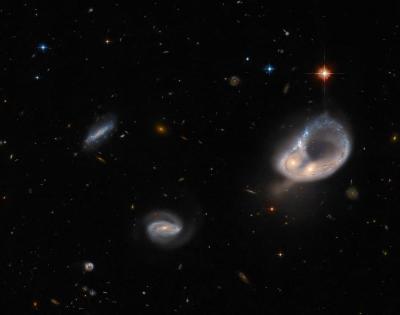 Hubble captures unusual galaxy merger in ancient universe | Hubble captures unusual galaxy merger in ancient universe