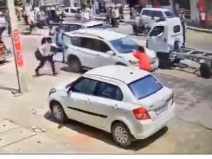 Woman dragged on bonnet of car in Raj, video goes viral. | Woman dragged on bonnet of car in Raj, video goes viral. Woman dragged on bonnet of car in Raj, video goes viral. | Woman dragged on bonnet of car in Raj, video goes viral.