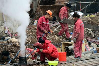 11 workers rescued from China gold mine after 2 weeks | 11 workers rescued from China gold mine after 2 weeks