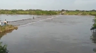 Three washed away in overflowing stream in Telangana | Three washed away in overflowing stream in Telangana