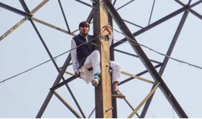 Denied ticket for MCD polls, ex-AAP councillor climbs atop transmission tower | Denied ticket for MCD polls, ex-AAP councillor climbs atop transmission tower