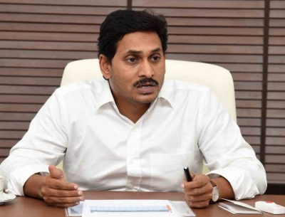 Andhra CM pays tributes to father YSR, releases mother's book | Andhra CM pays tributes to father YSR, releases mother's book