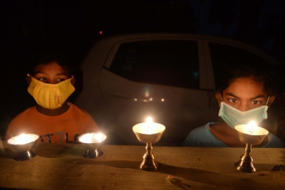 Oil lamps flicker as lights go off in Bengaluru | Oil lamps flicker as lights go off in Bengaluru