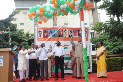 Chiranjeevi with mother hoists Tricolour | Chiranjeevi with mother hoists Tricolour