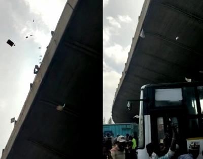 Man flings currency notes off Bengaluru flyover, faces case | Man flings currency notes off Bengaluru flyover, faces case