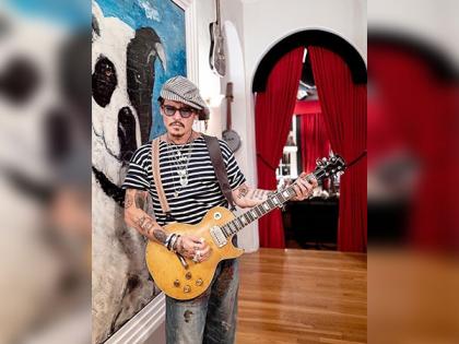 Johnny Depp makes surprise cameo at Jeff Beck's England concert | Johnny Depp makes surprise cameo at Jeff Beck's England concert