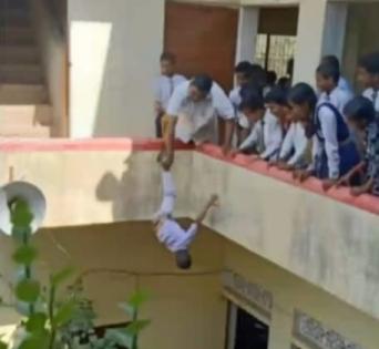 Shocking! UP: Principal hangs kid upside down from building | Shocking! UP: Principal hangs kid upside down from building