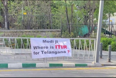 TRS banners with 17 questions greet Modi in Hyderabad | TRS banners with 17 questions greet Modi in Hyderabad