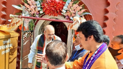 Amit Shah offers puja in Tripura temple, inaugurates silver made door | Amit Shah offers puja in Tripura temple, inaugurates silver made door