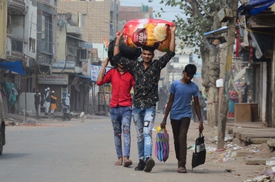 Traumatised Bengal workers return from violence-hit Delhi | Traumatised Bengal workers return from violence-hit Delhi Traumatised Bengal workers return from violence-hit Delhi | Traumatised Bengal workers return from violence-hit Delhi