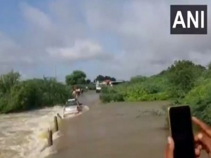 Andhra Pradesh: Locals rescue two men after car gets washed away in rivulet | Andhra Pradesh: Locals rescue two men after car gets washed away in rivulet