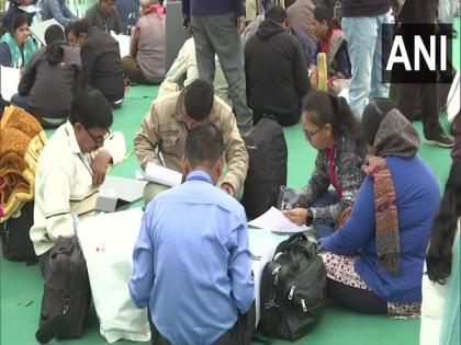 Gujarat phase 2 polls: Polling parties gather at EVM distribution centre in Gandhinagar | Gujarat phase 2 polls: Polling parties gather at EVM distribution centre in Gandhinagar Gujarat phase 2 polls: Polling parties gather at EVM distribution centre in Gandhinagar | Gujarat phase 2 polls: Polling parties gather at EVM distribution centre in Gandhinagar