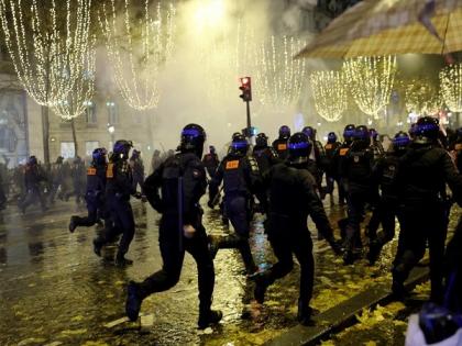 French police use tear gas against fans on Champs-Elysees in Paris: Report | French police use tear gas against fans on Champs-Elysees in Paris: Report