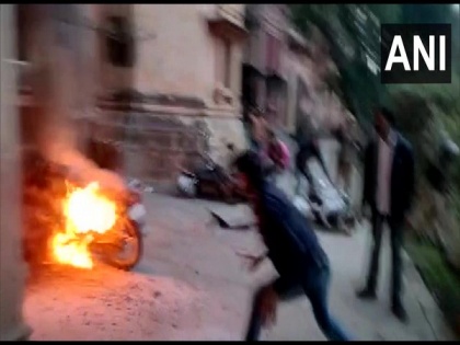 Allahabad University students protest against fee hike, torch bikes, damage car | Allahabad University students protest against fee hike, torch bikes, damage car