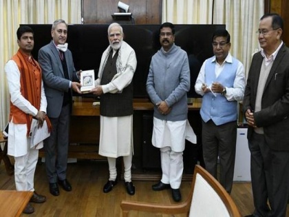 Dharmendra Pradhan presents book titled 'India: The Mother of Democracy' to PM Modi | Dharmendra Pradhan presents book titled 'India: The Mother of Democracy' to PM Modi