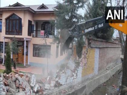 J-K: Boundary wall of Hizbul Mujahideen terrorist chief Amir Khan's house in Pahalgam razed | J-K: Boundary wall of Hizbul Mujahideen terrorist chief Amir Khan's house in Pahalgam razed