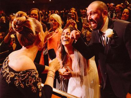 Adele signs a bride's wedding dress during her Las Vegas Residency Show | Adele signs a bride's wedding dress during her Las Vegas Residency Show