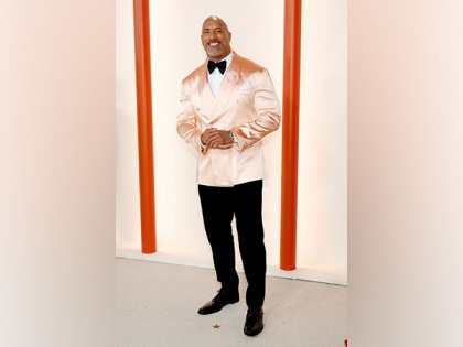 Oscars 2023 Red Carpet: Dwayne Johnson looks dapper in metallic pink suit | Oscars 2023 Red Carpet: Dwayne Johnson looks dapper in metallic pink suit