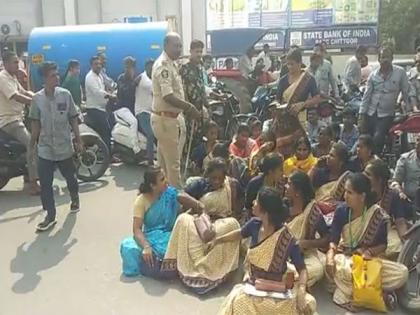 Fired without prior notice, garment shop employees stage protest in Andhra's Chittoor | Fired without prior notice, garment shop employees stage protest in Andhra's Chittoor