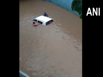 Gujarat: Car submerged at flooded Navsari underpass, occupants rescued | Gujarat: Car submerged at flooded Navsari underpass, occupants rescued