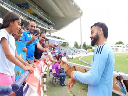 Virat Kohli makes fans' day in Bridgetown with autographs; receives bracelet from young fan | Virat Kohli makes fans' day in Bridgetown with autographs; receives bracelet from young fan