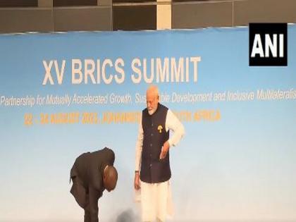 At BRICS Summit, PM Modi notices Tricolour on ground, picks it up; SA President Ramaphosa follows suit | At BRICS Summit, PM Modi notices Tricolour on ground, picks it up; SA President Ramaphosa follows suit At BRICS Summit, PM Modi notices Tricolour on ground, picks it up; SA President Ramaphosa follows suit | At BRICS Summit, PM Modi notices Tricolour on ground, picks it up; SA President Ramaphosa follows suit