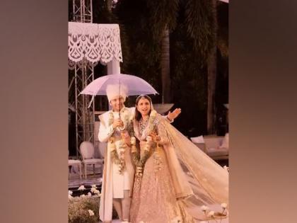 Parineeti Chopra, Raghav Chadha groove under umbrella as they walk down aisle | Parineeti Chopra, Raghav Chadha groove under umbrella as they walk down aisle