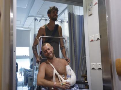 'Crazy chaos': Israeli survivor describes attack on beach rave | 'Crazy chaos': Israeli survivor describes attack on beach rave 'Crazy chaos': Israeli survivor describes attack on beach rave | 'Crazy chaos': Israeli survivor describes attack on beach rave