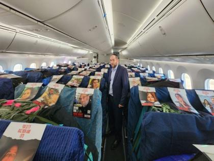 EL AL puts photos of captive Israelis on seats of humanitarian delivery flight | EL AL puts photos of captive Israelis on seats of humanitarian delivery flight EL AL puts photos of captive Israelis on seats of humanitarian delivery flight | EL AL puts photos of captive Israelis on seats of humanitarian delivery flight