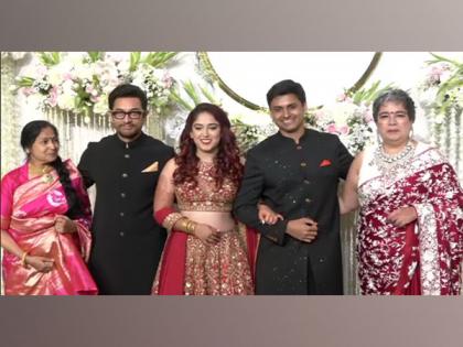 Aamir Khan poses with newlyweds Ira Khan, Nupur Shikhare at wedding reception | Aamir Khan poses with newlyweds Ira Khan, Nupur Shikhare at wedding reception Aamir Khan poses with newlyweds Ira Khan, Nupur Shikhare at wedding reception | Aamir Khan poses with newlyweds Ira Khan, Nupur Shikhare at wedding reception