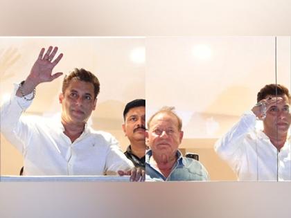 Salman Khan greets fans outside Galaxy Apartment on Eid, poses with his father Salim Khan | Salman Khan greets fans outside Galaxy Apartment on Eid, poses with his father Salim Khan Salman Khan greets fans outside Galaxy Apartment on Eid, poses with his father Salim Khan | Salman Khan greets fans outside Galaxy Apartment on Eid, poses with his father Salim Khan