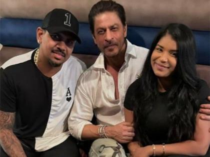 SRK shares a smile as he poses with KKR player Sunil Narine, his wife | SRK shares a smile as he poses with KKR player Sunil Narine, his wife SRK shares a smile as he poses with KKR player Sunil Narine, his wife | SRK shares a smile as he poses with KKR player Sunil Narine, his wife