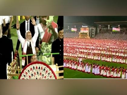 8,000 Jhumoir artists welcome PM Modi with their traditional performance at Guwahati's Sarusajai Stadium | 8,000 Jhumoir artists welcome PM Modi with their traditional performance at Guwahati's Sarusajai Stadium 8,000 Jhumoir artists welcome PM Modi with their traditional performance at Guwahati's Sarusajai Stadium | 8,000 Jhumoir artists welcome PM Modi with their traditional performance at Guwahati's Sarusajai Stadium