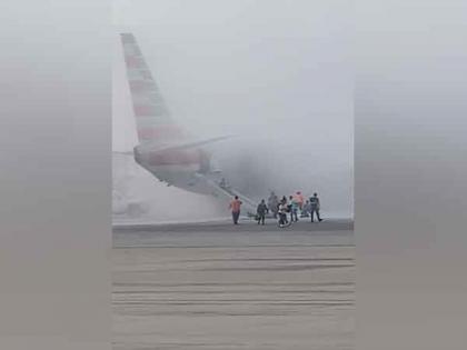 Passengers evacuated as American Airlines plane catches fire in Denver | Passengers evacuated as American Airlines plane catches fire in Denver Passengers evacuated as American Airlines plane catches fire in Denver | Passengers evacuated as American Airlines plane catches fire in Denver