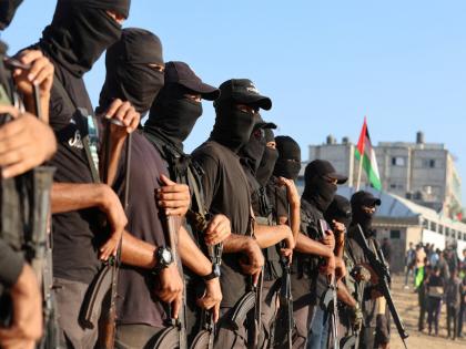 Hamas says it remains committed to ceasefire deal after handing over 7 out of 20 hostages to Red Cross | Hamas says it remains committed to ceasefire deal after handing over 7 out of 20 hostages to Red Cross