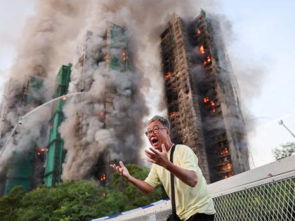 Huge blaze engulfs Hong Kong high-rise; kills four, injures three | Huge blaze engulfs Hong Kong high-rise; kills four, injures three