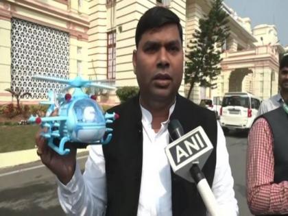 RJD leader reaches Bihar Assembly with toy helicopter to trace liquor | RJD leader reaches Bihar Assembly with toy helicopter to trace liquor