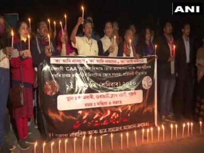Assam: Year on, Nagarik Samaj takes out candlelight march against CAA | Assam: Year on, Nagarik Samaj takes out candlelight march against CAA Assam: Year on, Nagarik Samaj takes out candlelight march against CAA | Assam: Year on, Nagarik Samaj takes out candlelight march against CAA