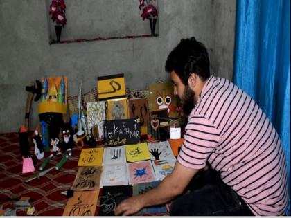 Youth from J-K's Pulwama enters India Book of Records with smallest origami paper flower creation | Youth from J-K's Pulwama enters India Book of Records with smallest origami paper flower creation Youth from J-K's Pulwama enters India Book of Records with smallest origami paper flower creation | Youth from J-K's Pulwama enters India Book of Records with smallest origami paper flower creation