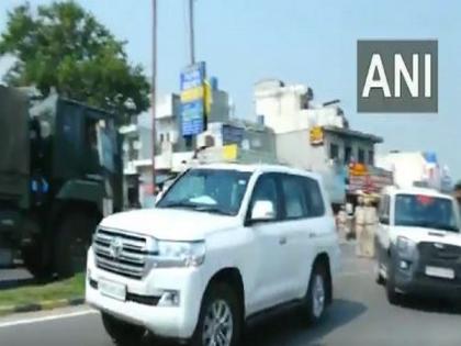 Protester throws shoe at SAD president Sukhbir Singh Badal's vehicle in Punjab's Jalandhar | Protester throws shoe at SAD president Sukhbir Singh Badal's vehicle in Punjab's Jalandhar