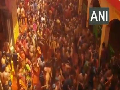 COVID-19: Devotees gather in huge number to play 'Kapda Fad' Holi in Mathura | COVID-19: Devotees gather in huge number to play 'Kapda Fad' Holi in Mathura