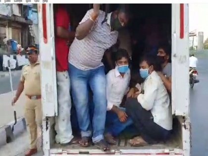 Mumbai police intercepts tempo carrying 17 migrant labourers, sends them home | Mumbai police intercepts tempo carrying 17 migrant labourers, sends them home
